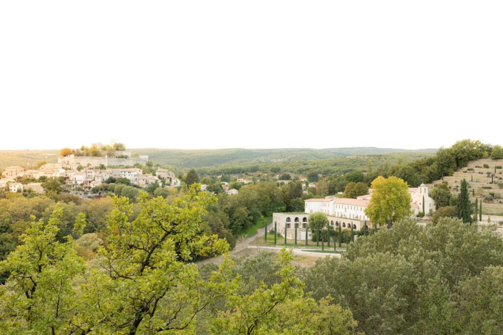 Panoramic view of the Couvent des Minimes Hotel & Spa nestled in the green landscape of Mane en Provence