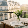 Lily of the valley bouquet on a Parisian balcony with a note reading: Pour un 1er Mai plein de bonheur.. Amour, Sophie.