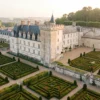 High-angle view of the symmetrical Renaissance gardens at Chateau de Villandry during golden sunrise