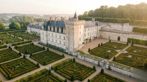 High-angle view of the symmetrical Renaissance gardens at Chateau de Villandry during golden sunrise